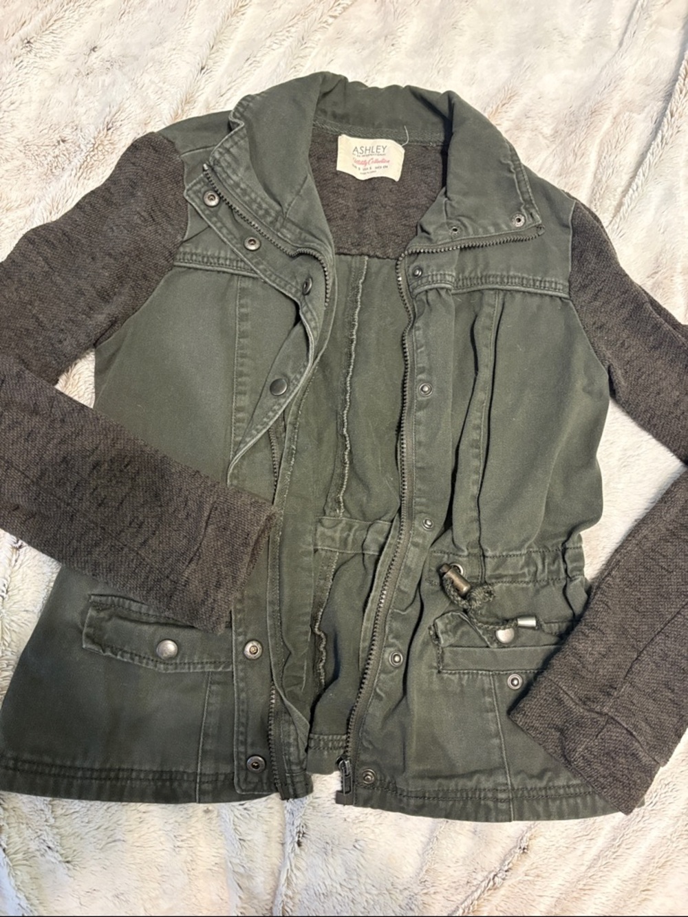 Ashley Graham olive green utility jacket with knit sleeves